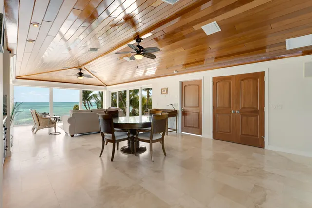 a view of house with yard and sitting area