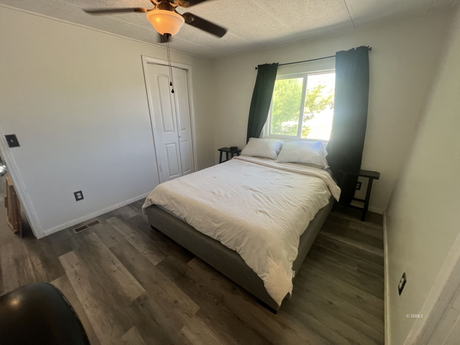 1341 North Calvert Boulevard Ridgecrest, CA 93555 - Photo 11 of 21 a bedroom with a bed and window
