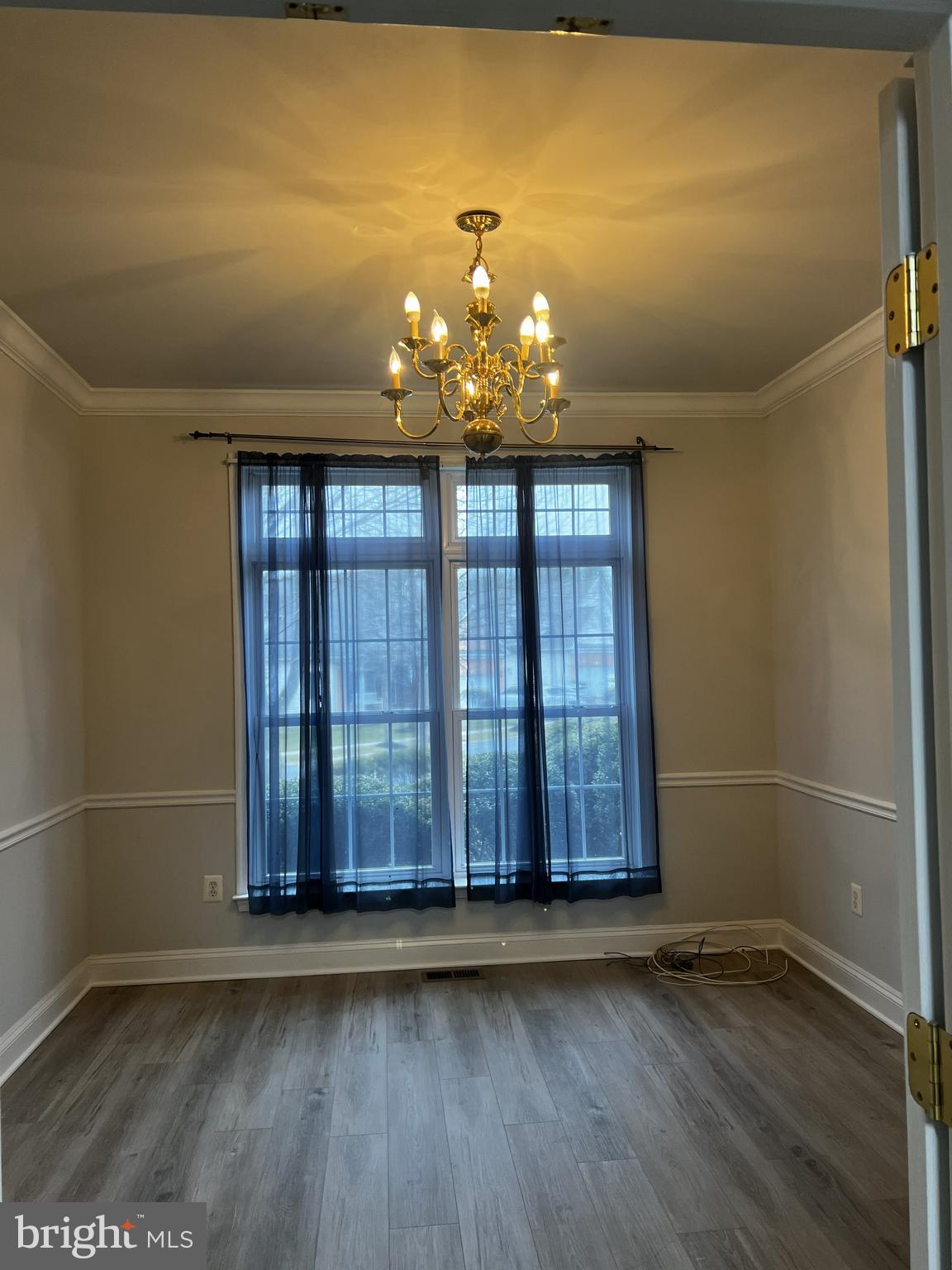 101 Westgate Way Reisterstown, MD 21136 - Photo 3 of 10 an empty room with wooden floor and windows