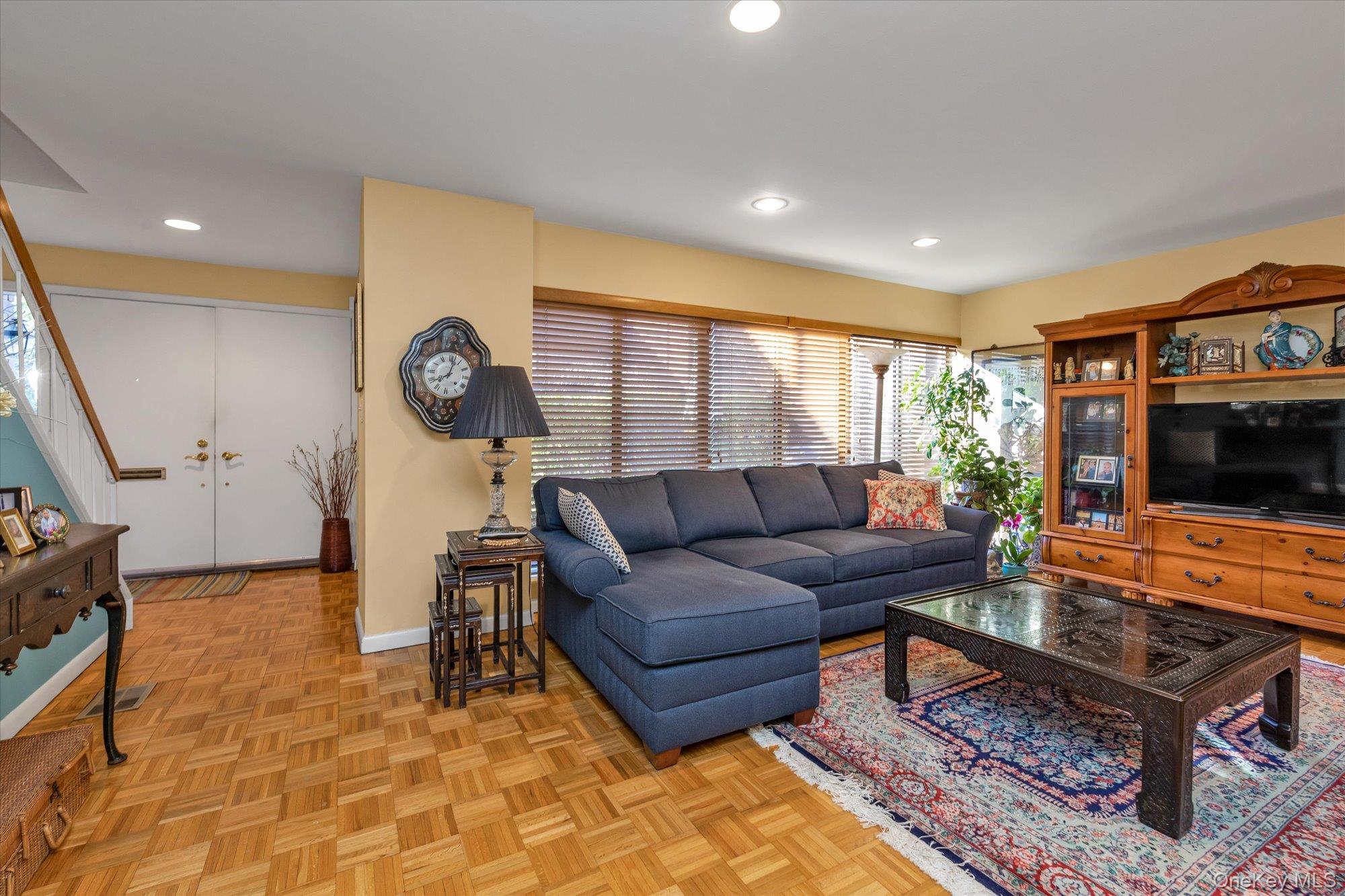 15 Spring Hollow Road Roslyn, NY 11576 - Photo 6 of 30 a living room with furniture and a flat screen tv