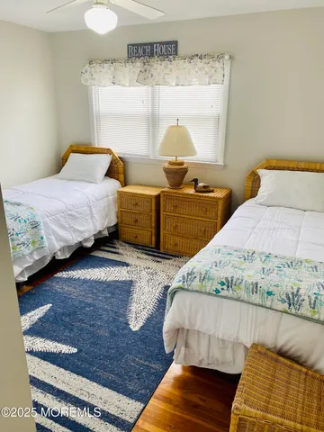 a bedroom with bed and window