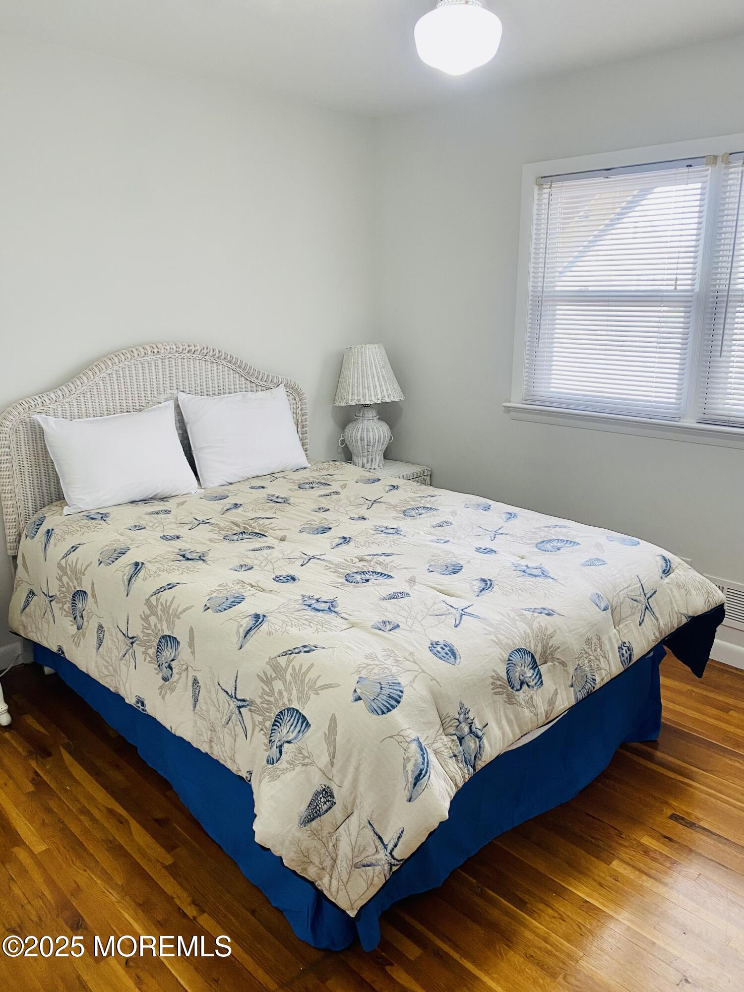 4 Camden Avenue, Unit WINTER Lavallette, NJ 08735 - Photo 9 of 13 a large bed sitting in a bedroom next to a window