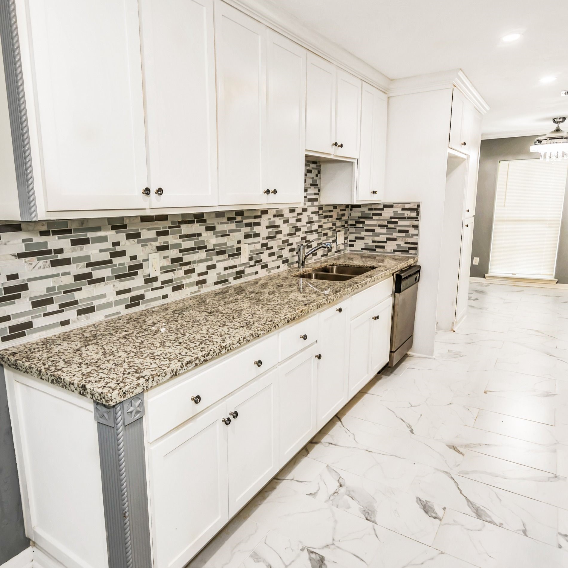 481 County Road 2084 Liberty, TX 77575 - Photo 10 of 21 a kitchen with granite countertop white cabinets and white appliances