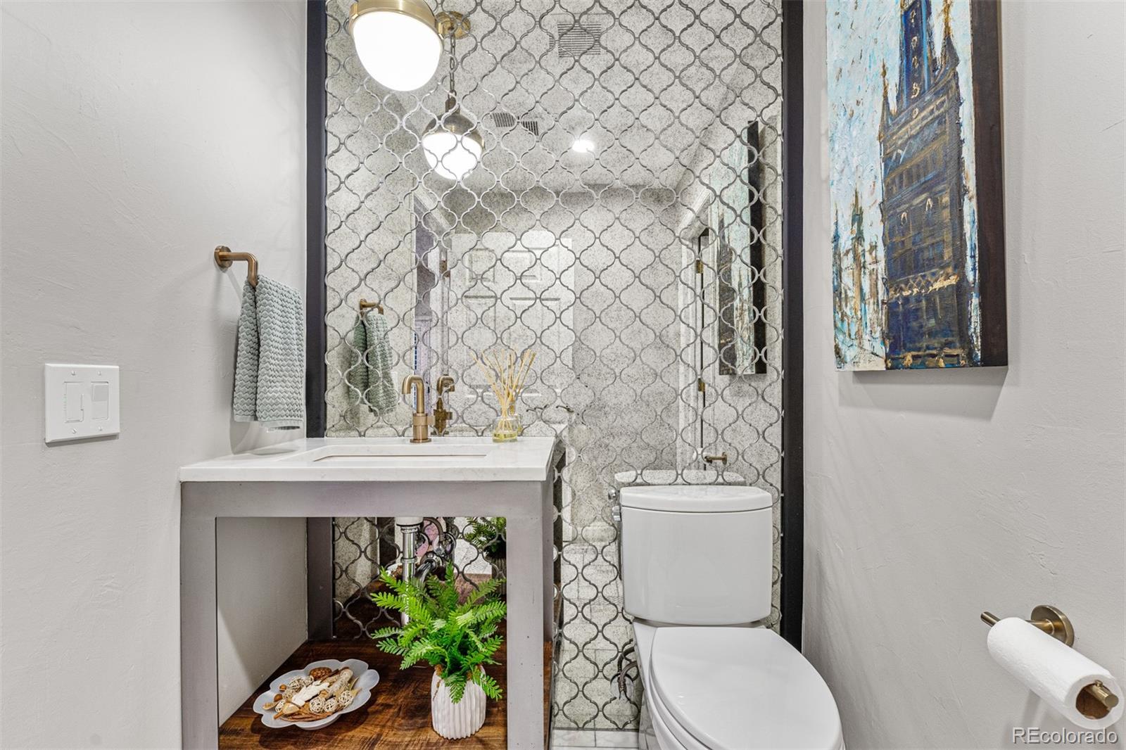 7340 Rattlesnake Drive Lone Tree, CO 80124 - Photo 17 of 33 a bathroom with a toilet and a sink