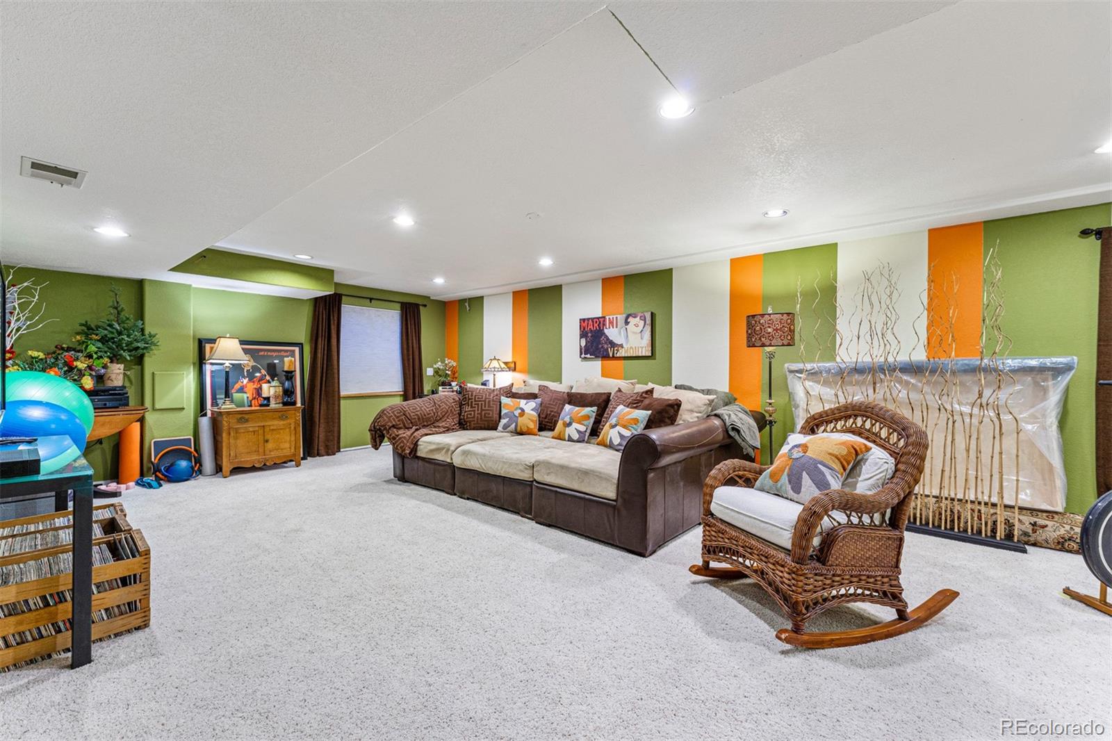 7340 Rattlesnake Drive Lone Tree, CO 80124 - Photo 26 of 33 a living room with furniture gym equipment and a fireplace