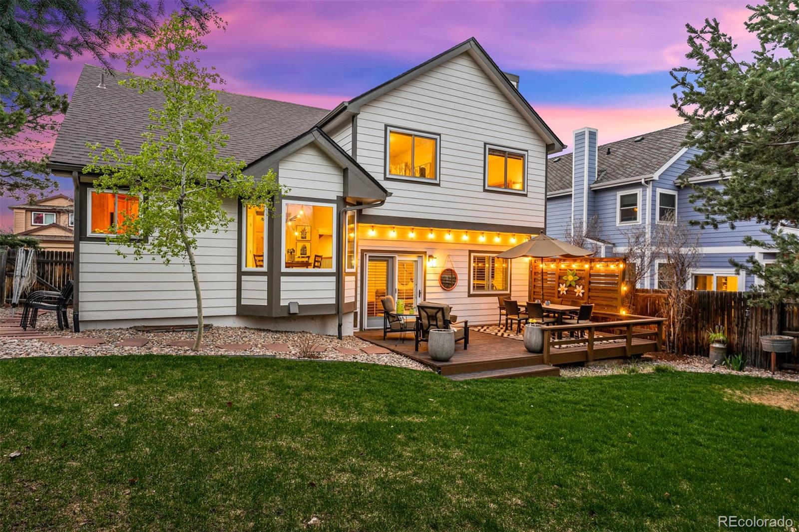 7340 Rattlesnake Drive Lone Tree, CO 80124 - Photo 30 of 33 a view of a house with a yard and sitting area