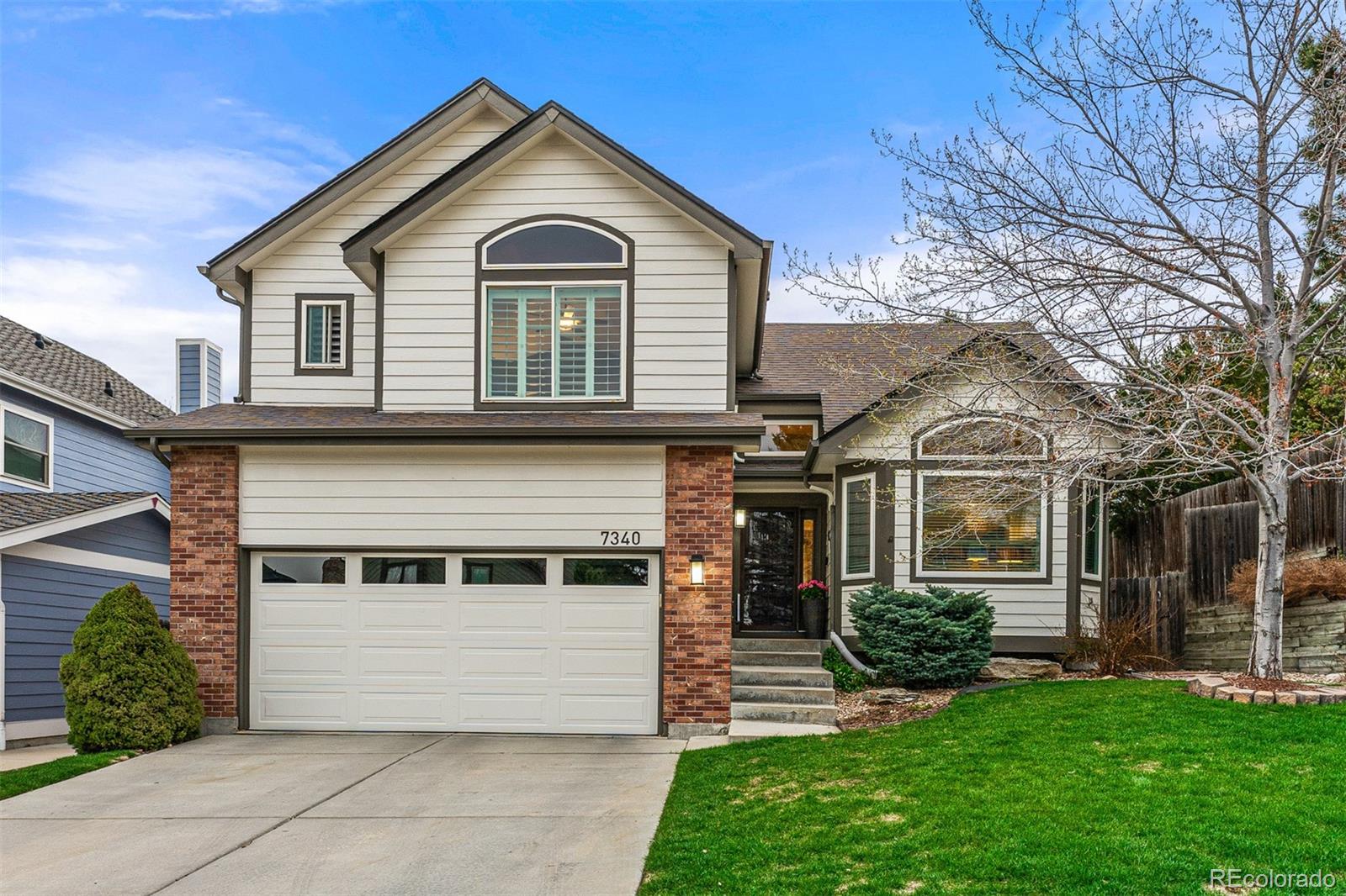 7340 Rattlesnake Drive Lone Tree, CO 80124 - Photo 33 of 33 a front view of a house with a yard
