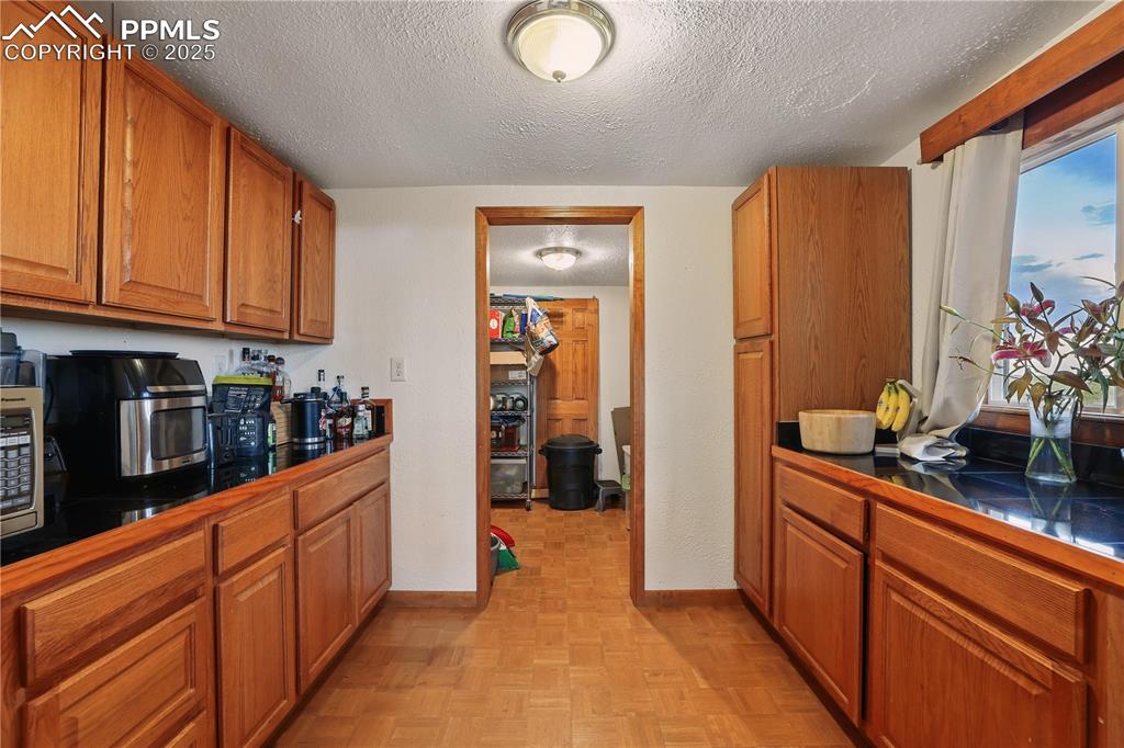 6615 Mulberry Road Calhan, CO 80808 - Photo 15 of 50 a kitchen with stainless steel appliances granite countertop a refrigerator and a sink