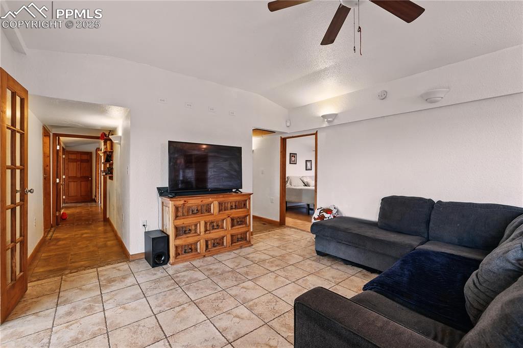 6615 Mulberry Road Calhan, CO 80808 - Photo 21 of 50 a living room with furniture and a flat screen tv