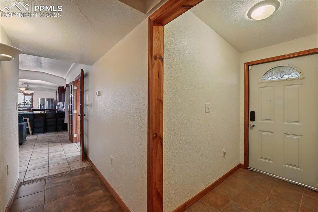 6615 Mulberry Road Calhan, CO 80808 - Photo 22 of 50 a view of hallway with a living room