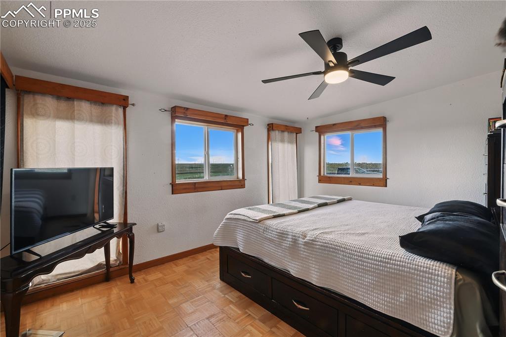 6615 Mulberry Road Calhan, CO 80808 - Photo 24 of 50 a bedroom with a bed and a flat screen tv