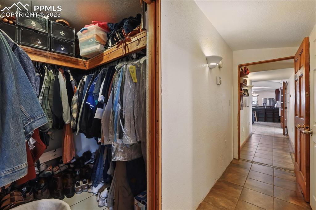6615 Mulberry Road Calhan, CO 80808 - Photo 27 of 50 a view of walk in closet with clothes and shoes