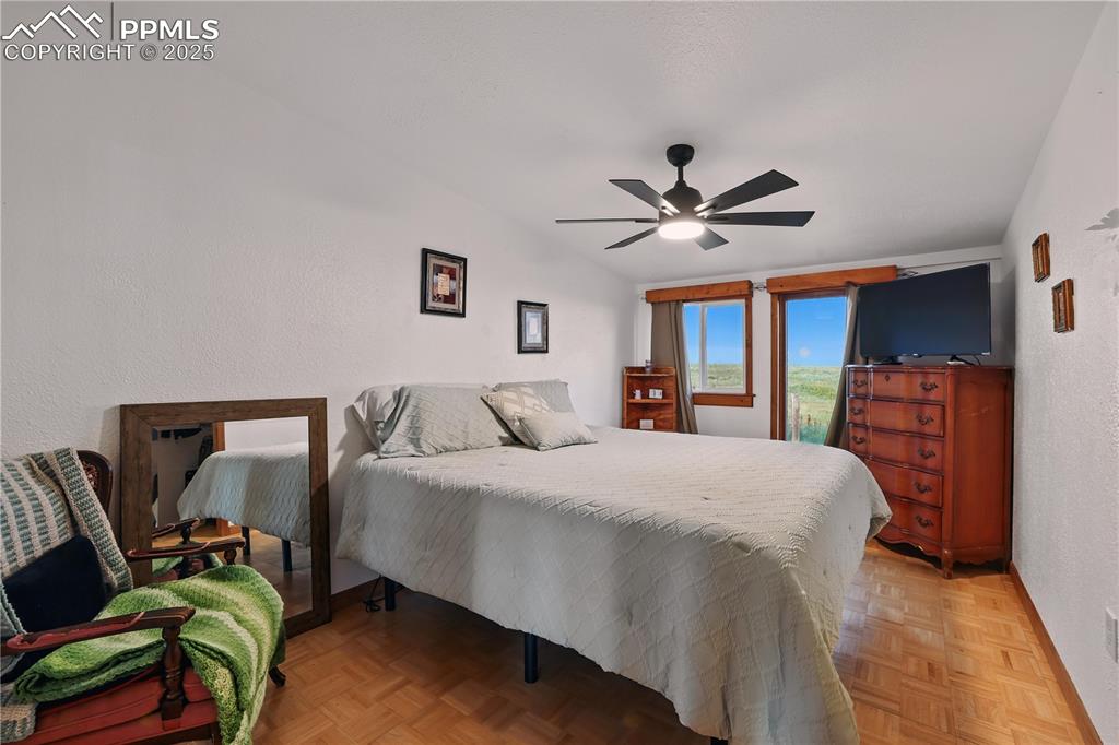 6615 Mulberry Road Calhan, CO 80808 - Photo 28 of 50 a bed room with a bed and a ceiling fan