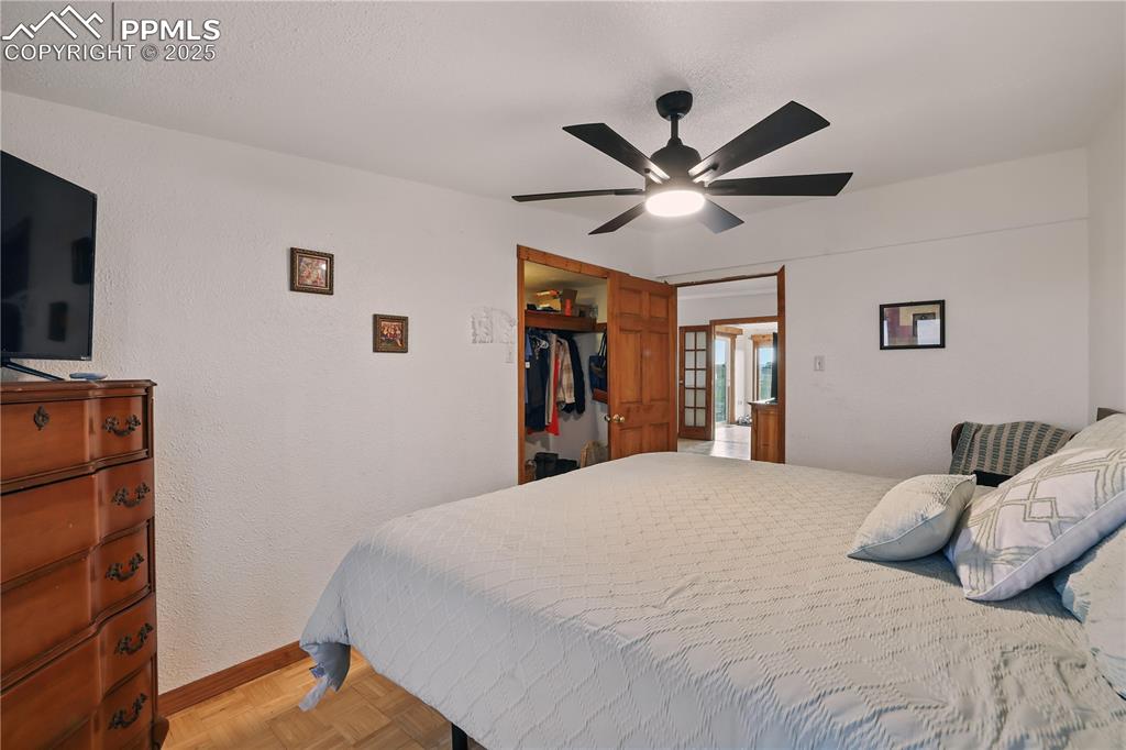 6615 Mulberry Road Calhan, CO 80808 - Photo 29 of 50 a bedroom with a large bed and a window