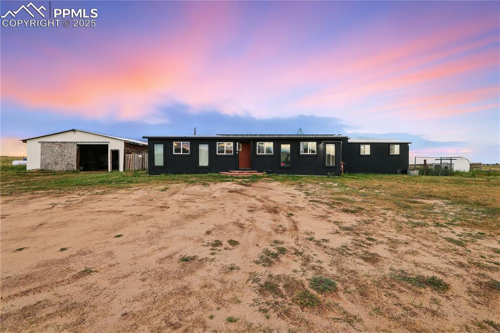 6615 Mulberry Road Calhan, CO 80808 - Photo 3 of 50 a view of a house with a yard