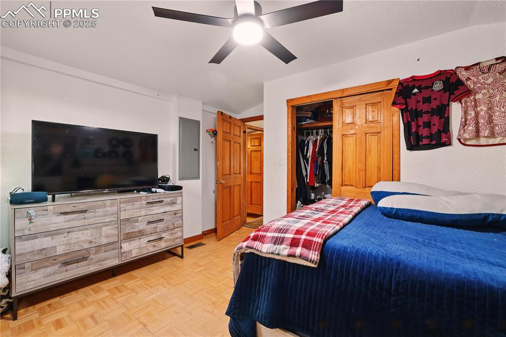 6615 Mulberry Road Calhan, CO 80808 - Photo 32 of 50 a bedroom with a bed and a flat screen tv