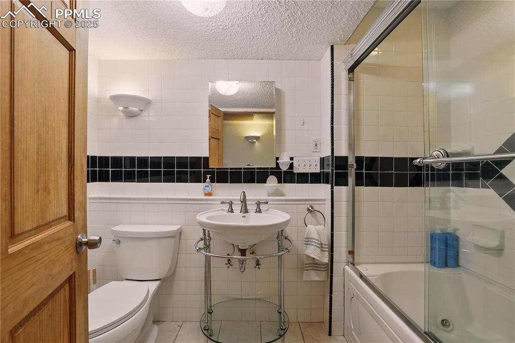 6615 Mulberry Road Calhan, CO 80808 - Photo 33 of 50 a bathroom with a sink a toilet and shower