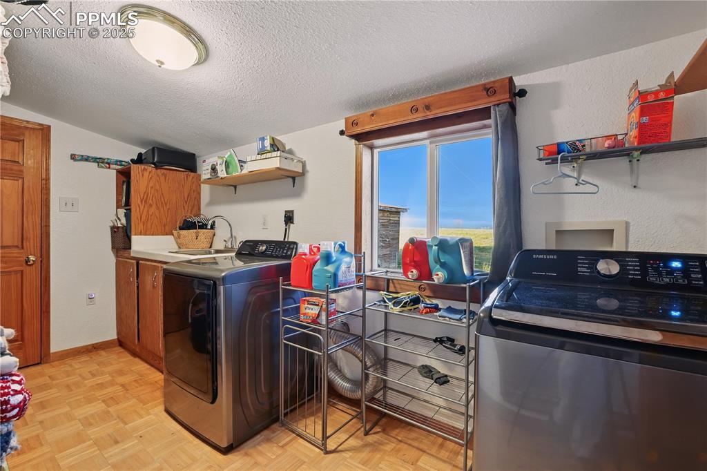 6615 Mulberry Road Calhan, CO 80808 - Photo 39 of 50 a room with storage and utility