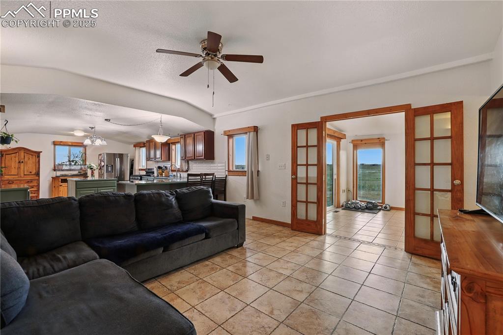 6615 Mulberry Road Calhan, CO 80808 - Photo 4 of 50 a living room with furniture and a large window