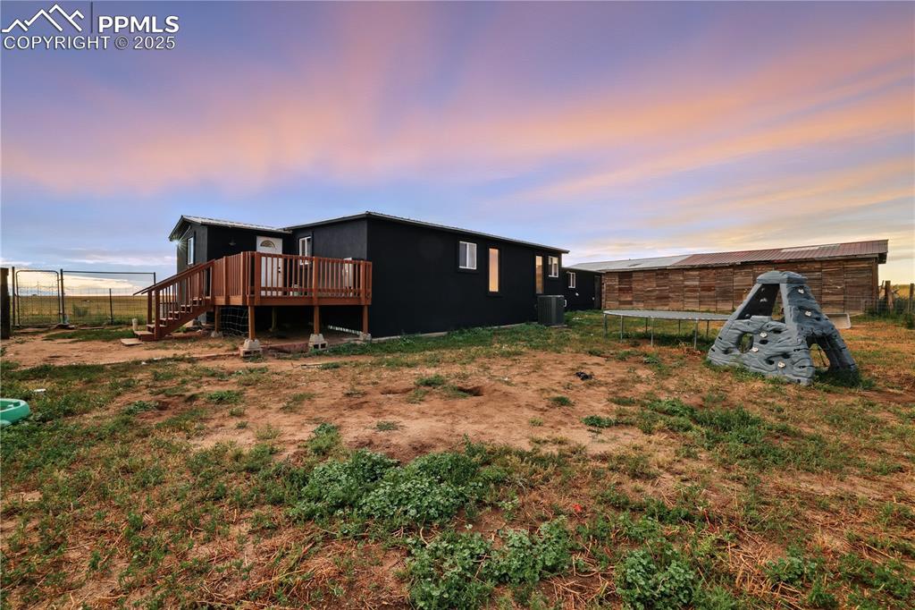 6615 Mulberry Road Calhan, CO 80808 - Photo 41 of 50 a view of a house with a yard
