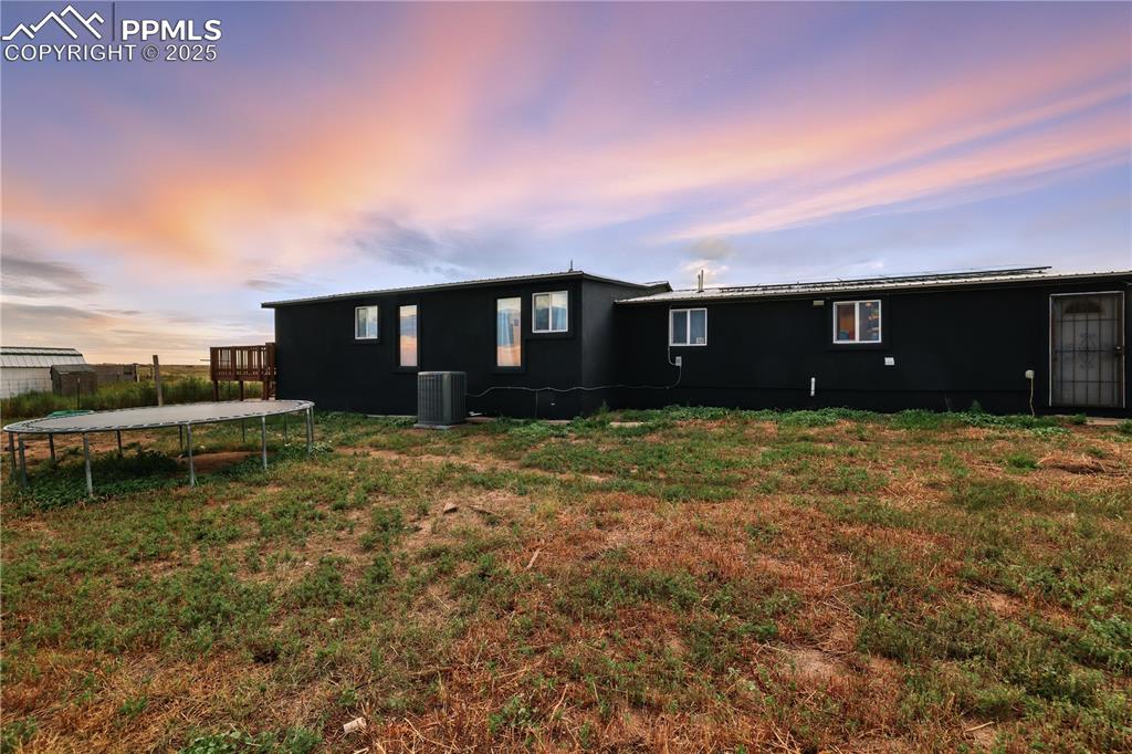 6615 Mulberry Road Calhan, CO 80808 - Photo 42 of 50 a view of a house with a yard