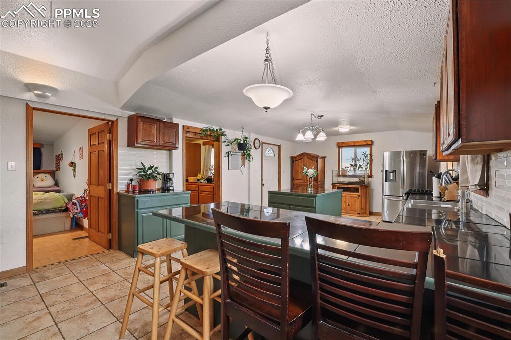 6615 Mulberry Road Calhan, CO 80808 - Photo 6 of 50 a view of a dining room with furniture