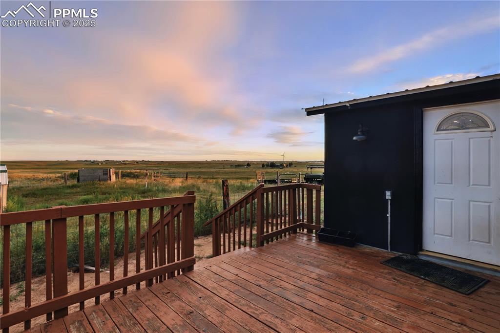 6615 Mulberry Road Calhan, CO 80808 - Photo 10 of 50 a view of a balcony with wooden floor
