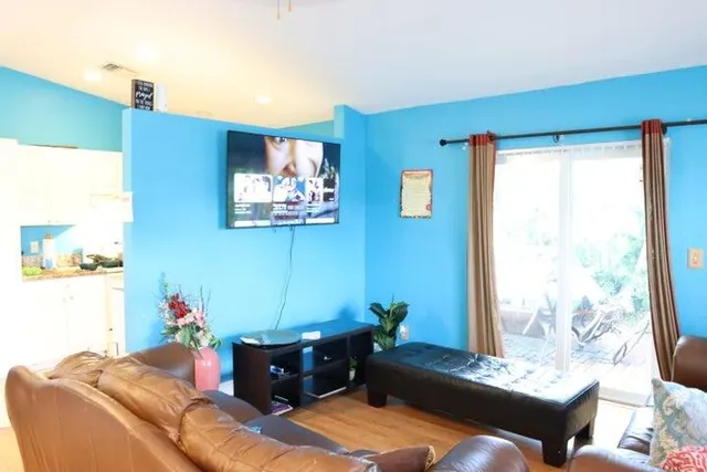 a living room with furniture and a window