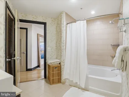 a bathroom with a shower and a tub