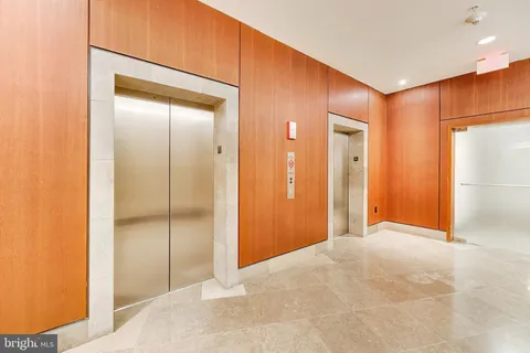 a view of a swimming pool with a roof deck and living room