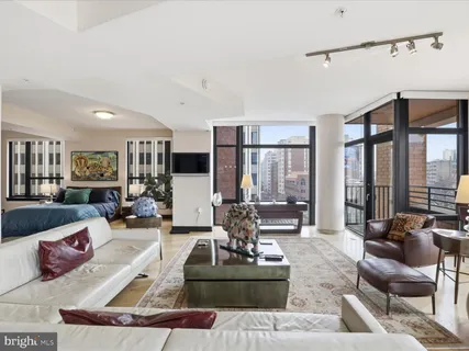 a living room with furniture or couch and a large window