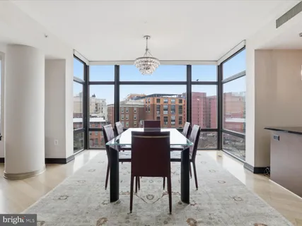 a view of a dining room with furniture window and outside view