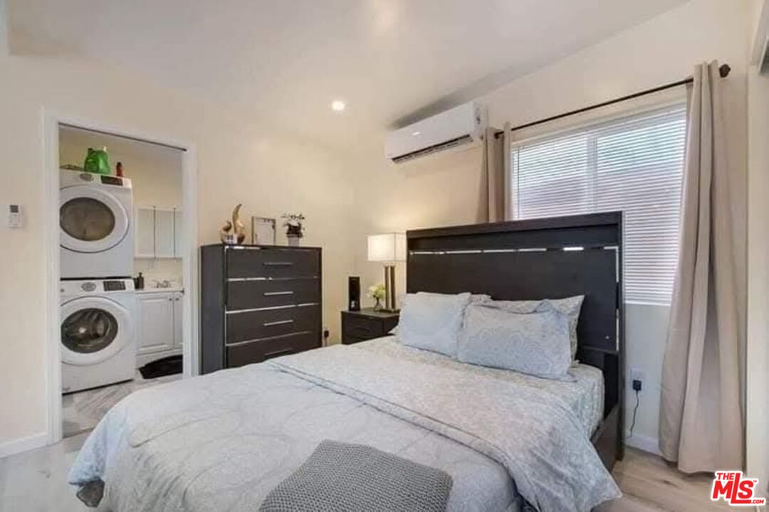 5133 Brynhurst Avenue View Park, CA 90043 - Photo 25 of 29 a bedroom with a bed and a window