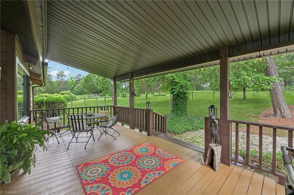 6741 Layton Road Liberty, NC 27298 - Photo 4 of 50 Sit outside any day under this covered front porch.