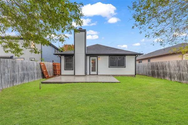 a backyard of a house with seating space