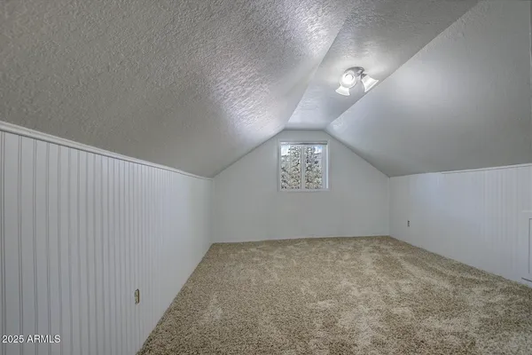 an empty room with a empty space and a window