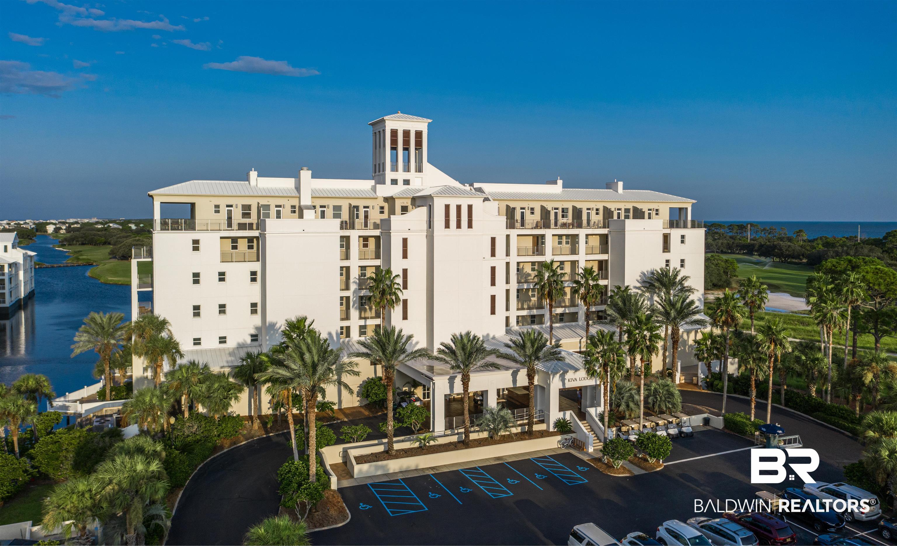 815 Plantation Road, Unit 405 Gulf Shores, AL 36542 - Photo 1 of 39 View of building exterior featuring a water view