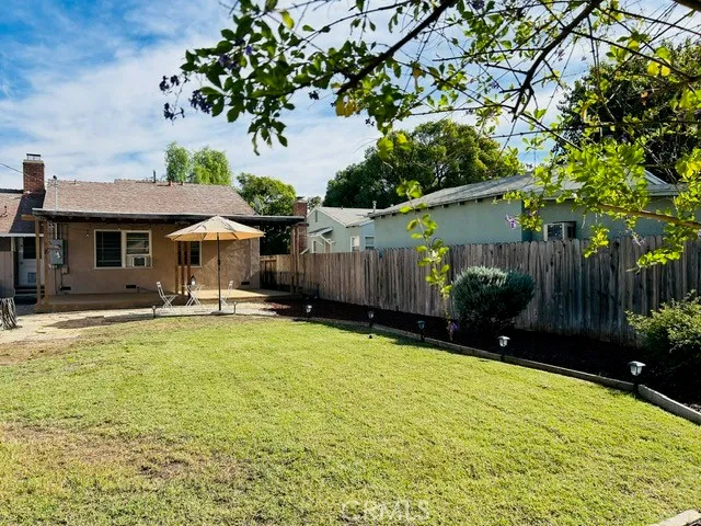 a swimming pool with outdoor seating and yard