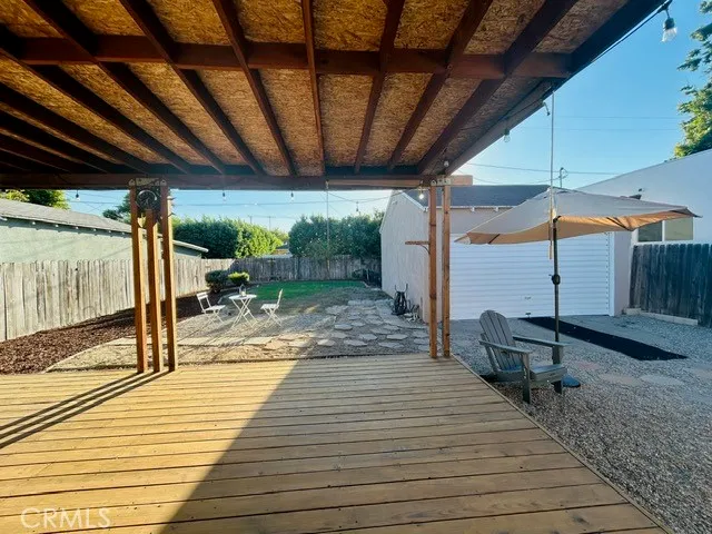 a patio with table and chairs