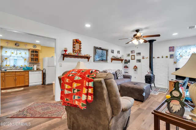 a bedroom with furniture and a wooden floor