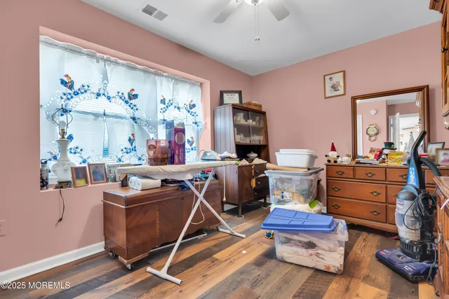 a room with gym equipment and a flat screen tv