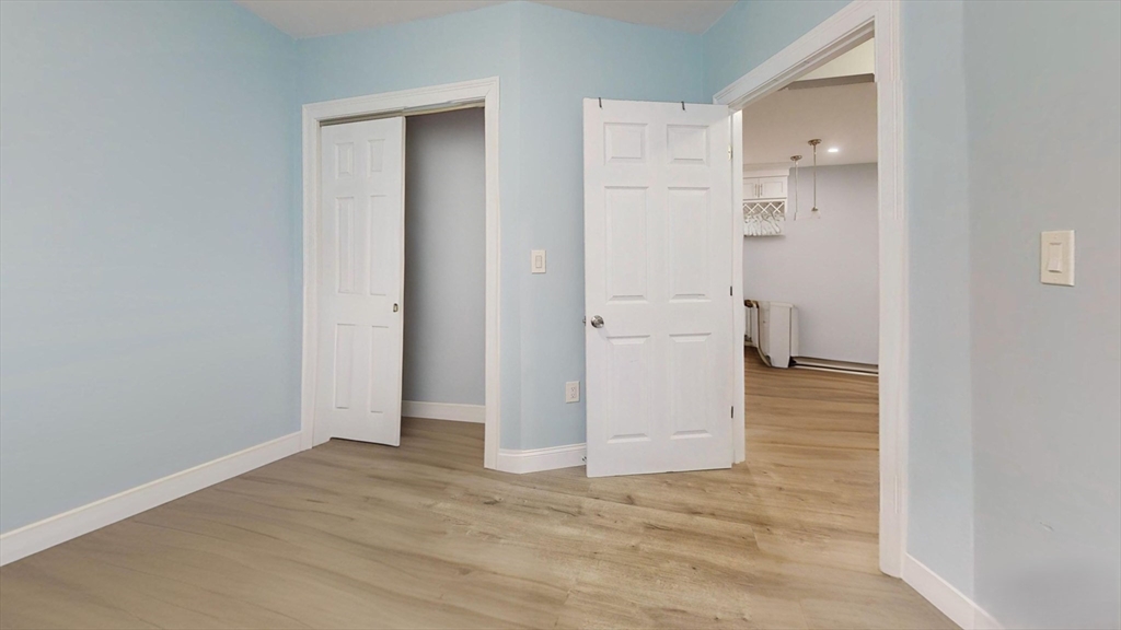 346 Cherry Street, Unit 2 Newton, MA 02465 - Photo 9 of 12 wooden floor in an empty room
