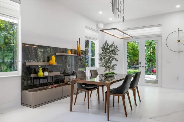 a bedroom with a bed and large window