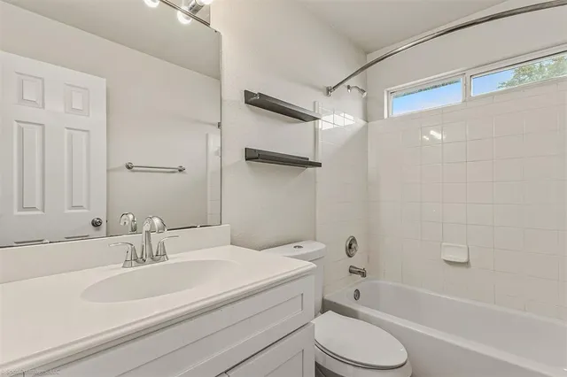 a bathroom with a sink toilet and a bathtub