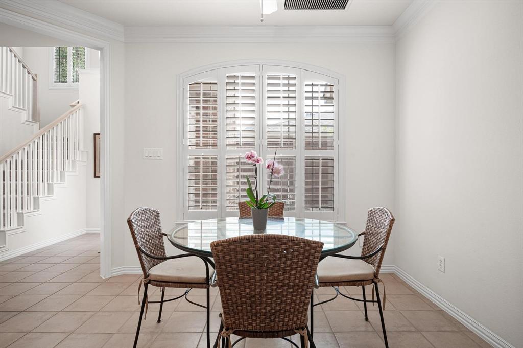 4209 Sexton Lane Dallas, TX 75229 - Photo 13 of 27 a dining room with furniture and a window