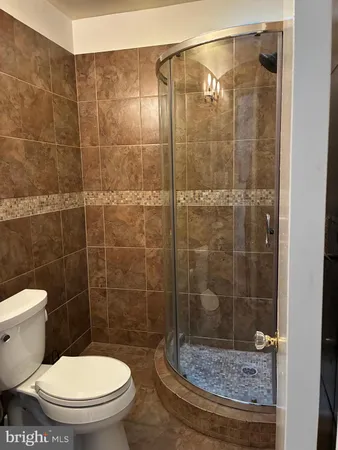 a bathroom with a toilet and a sink