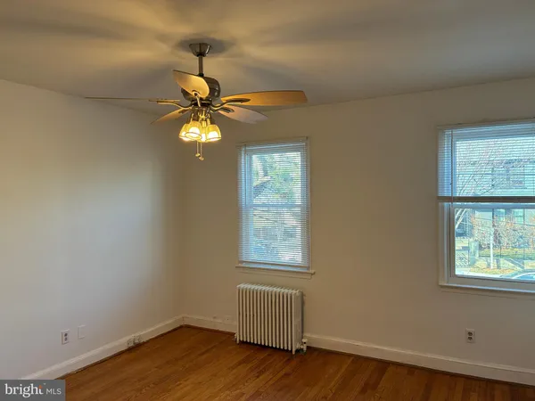 a bedroom with a bed window and a couch
