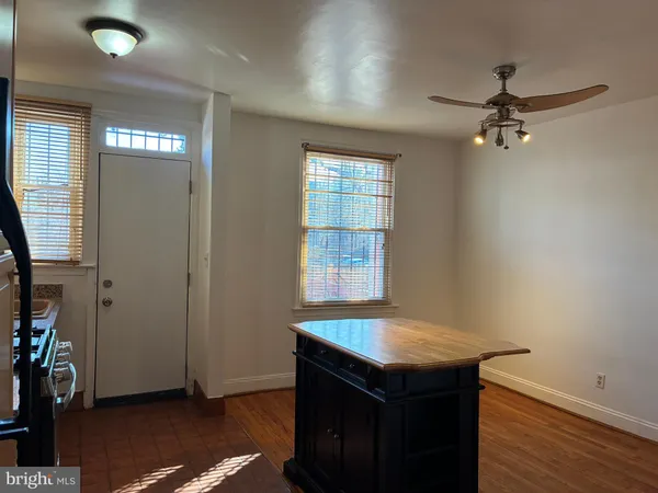 a kitchen with stainless steel appliances a stove refrigerator sink and cabinets