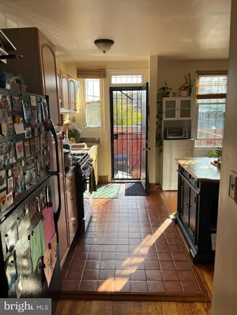 a view of kitchen island with wooden floor