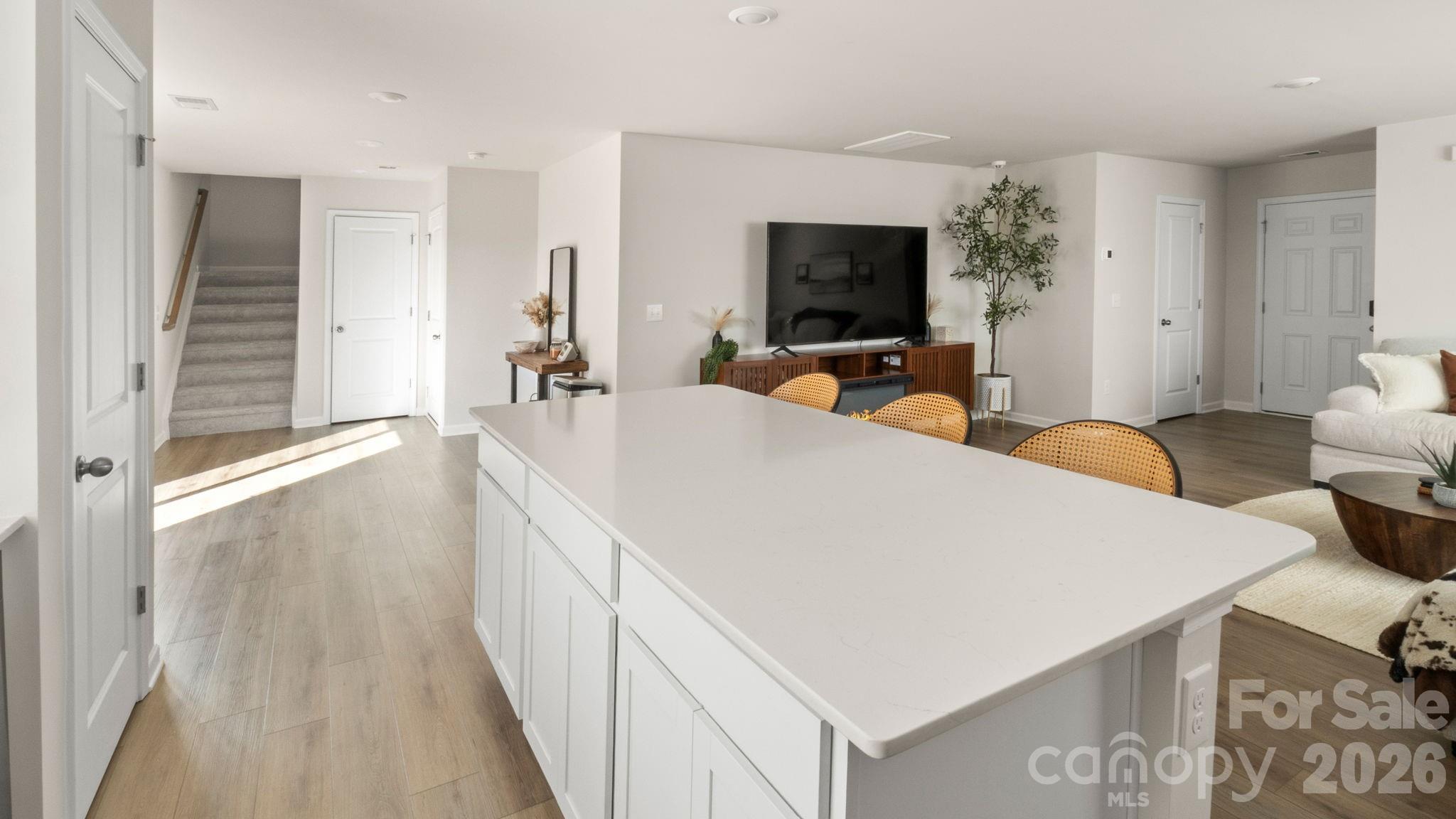 1615 Spring Edgemoor Sc 29712 Edgemoor, SC 29712 - Photo 14 of 30 a large white room with a large bed and a flat tv screen on a dresser